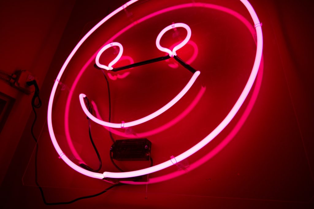 Pink neon smiley face
